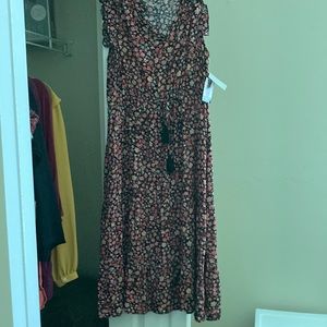 Cute, Long sundress. NWT. Elastic waistband, ruffle on bottom. 100% rayon